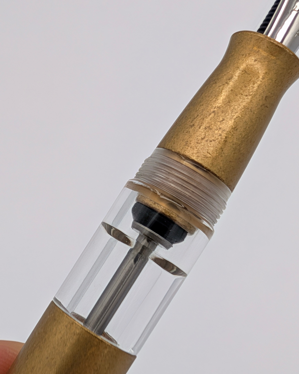 Ink window and vacuum filling plunger inside the Liberum Volucris Brass Stone Washed