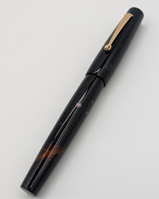 Liberum Star Shine fountain pen, capped, black natural lacquer with gold powder, mother-of-pearl inlays and a gold-tone clip