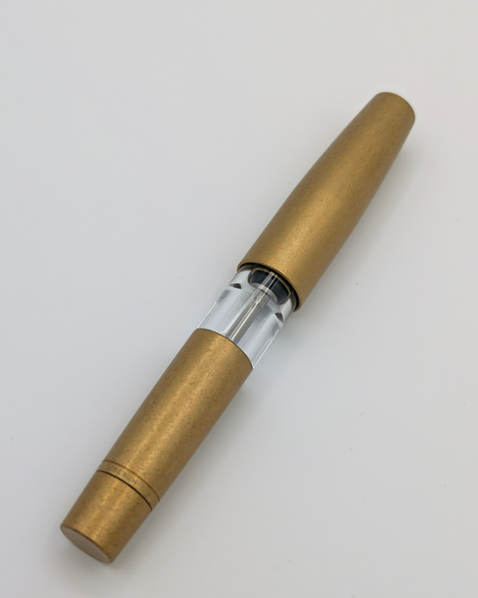 Liberum Volucris Brass Stone Washed pocket fountain pen, capped, with a transparent ink window