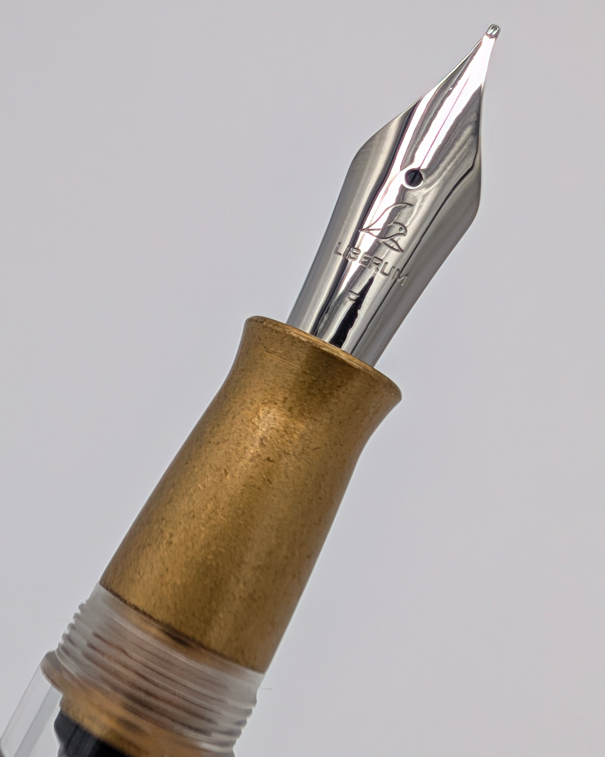 Liberum-engraved #6 stainless steel nib on the Volucris Brass Stone Washed fountain pen
